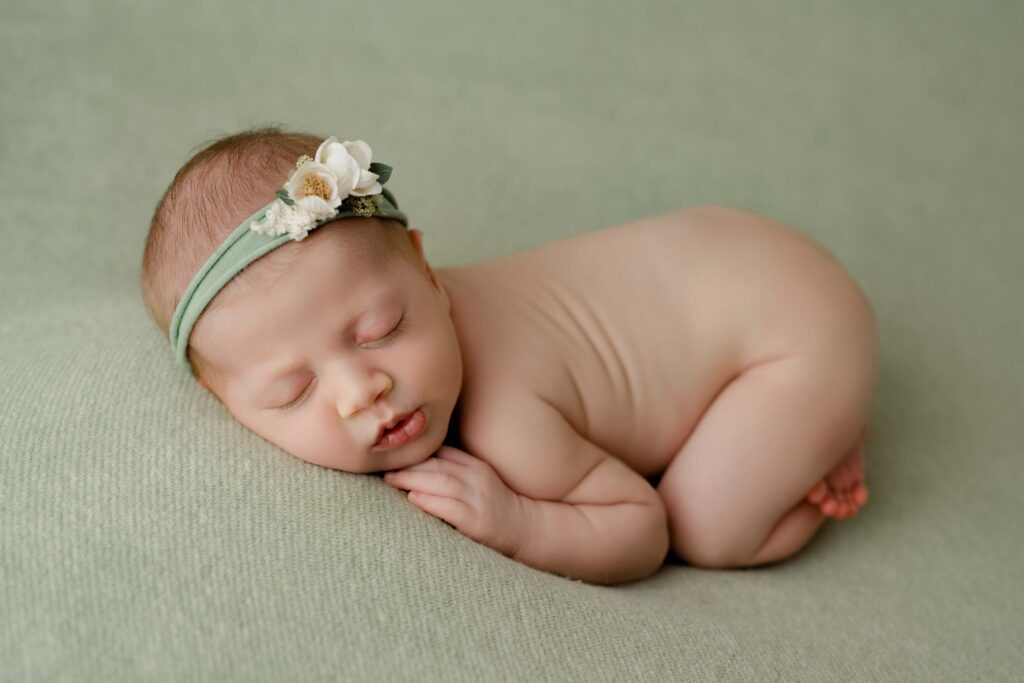 newborn baby girl birmingham al newborn photography baby on green blanket